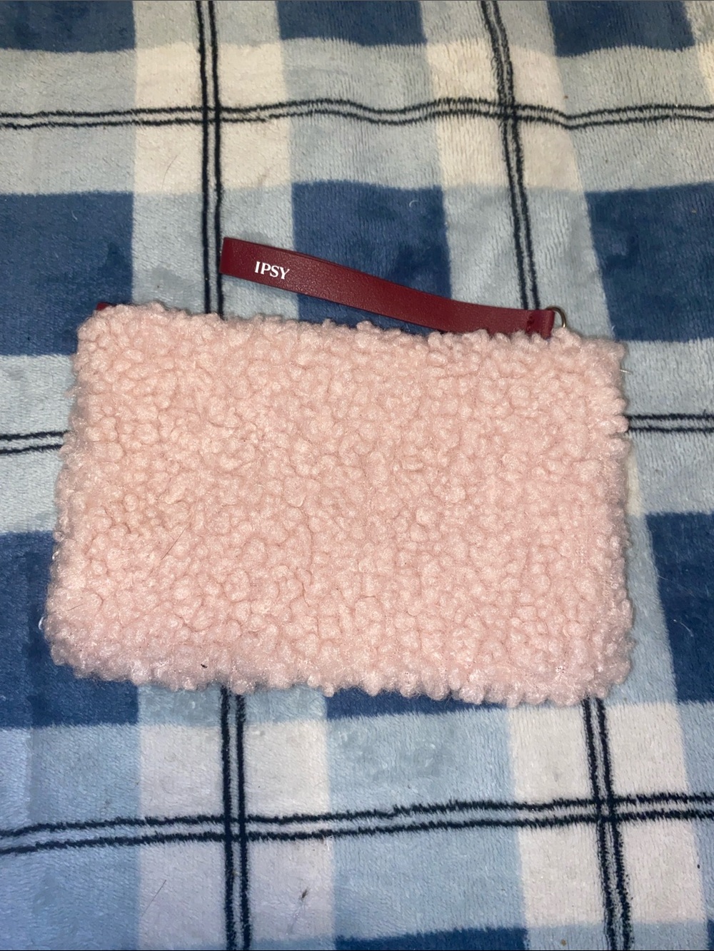 ipsy Light Pink Sherpa Wristlet with Red Strap